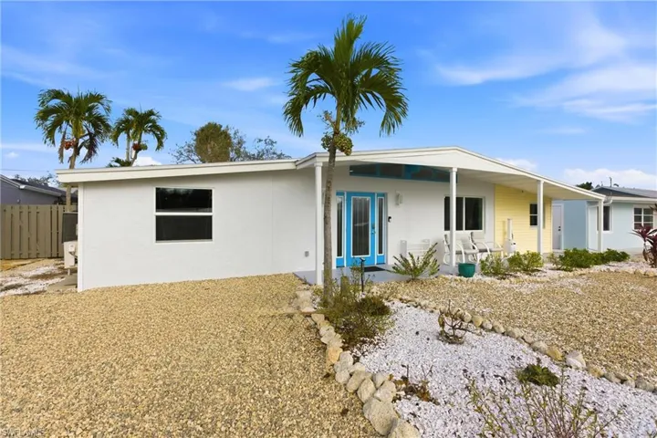 Rear view of house featuring stucco siding