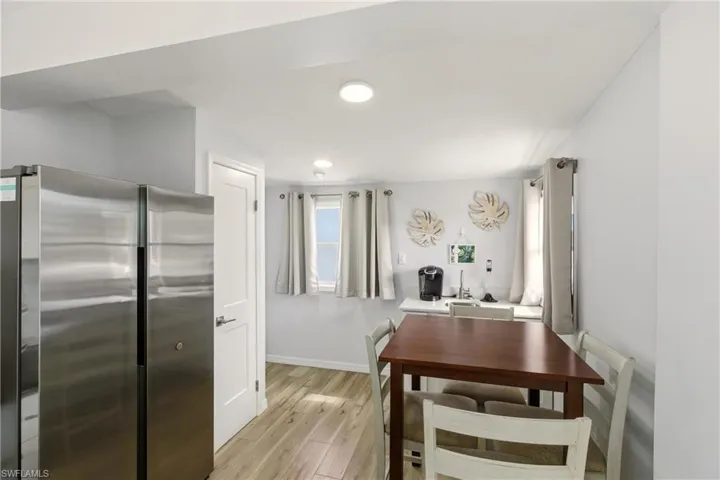 Dining room featuring light wood finished floors and recessed lighting