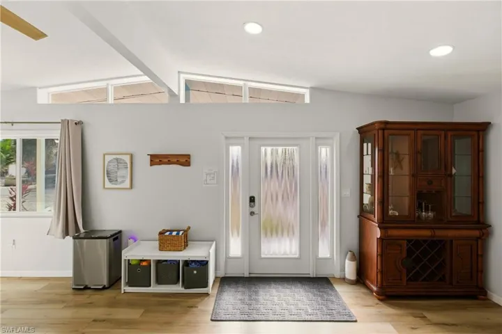 Entryway featuring baseboards and light wood-style floors