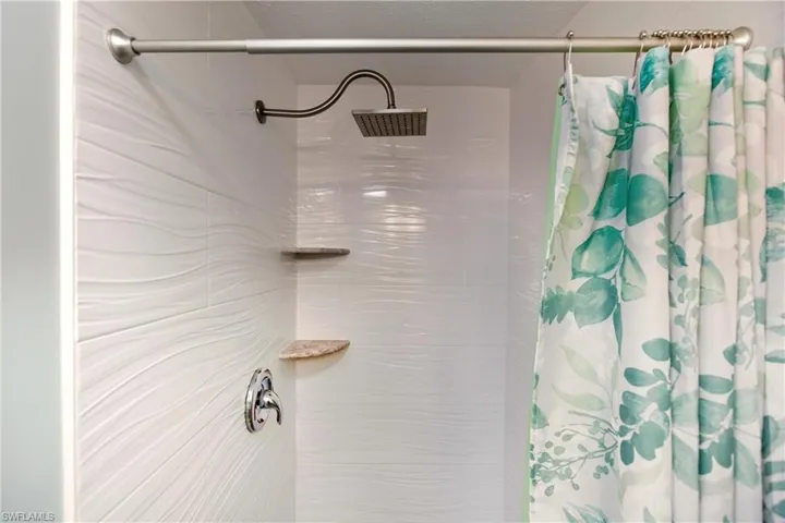 Full bathroom featuring a shower with shower curtain