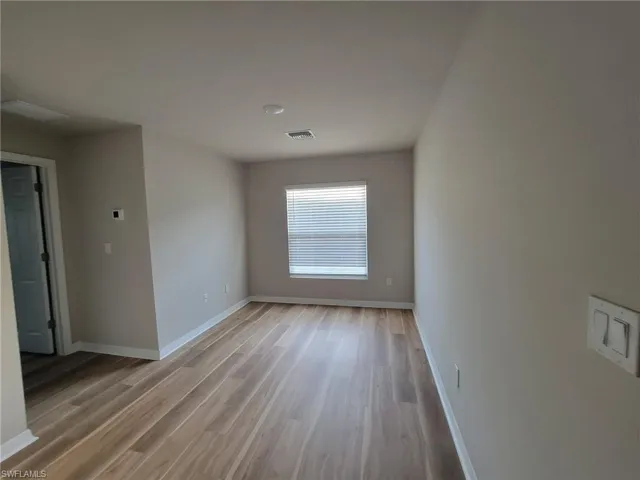 Spare room featuring hardwood / wood-style floors