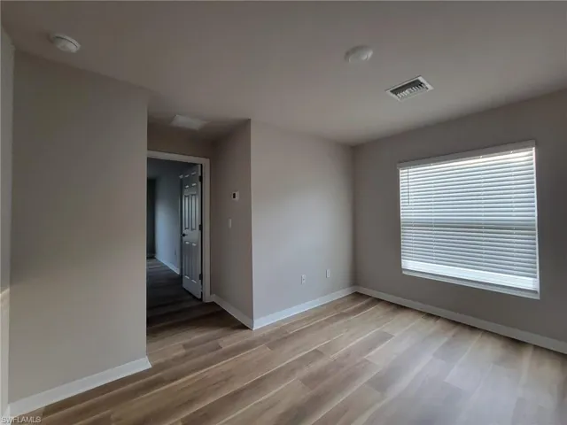 Spare room featuring hardwood / wood-style flooring