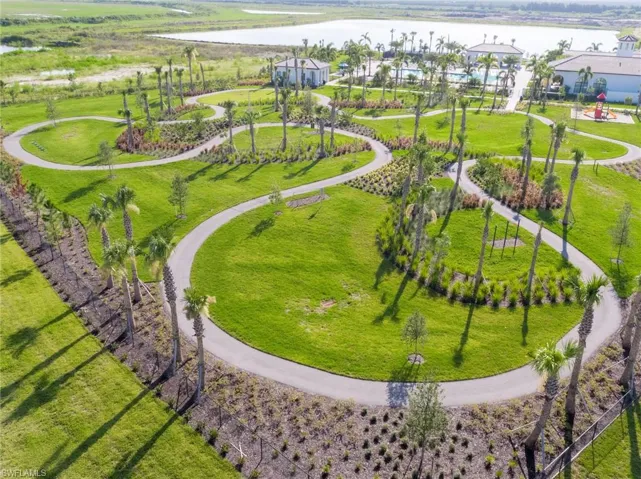 Bird's eye view of a nearby body of water and a community park