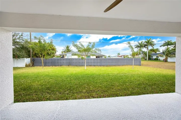 View of yard with a patio area and ceiling fan