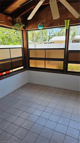 Unfurnished sunroom with plenty of natural light