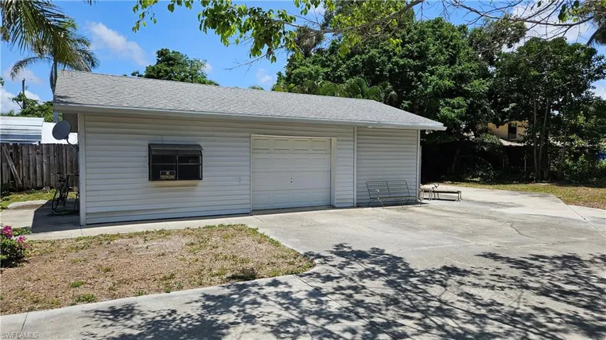 Garage featuring driveway