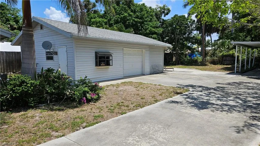 Detached garage featuring driveway