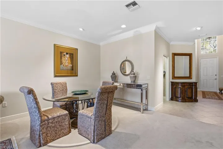 Recessed lighting illumination, crown molding, and high ceilings