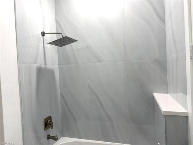 Bathroom featuring shower / bathtub combination