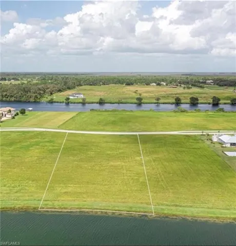 Overview of rural landscape with a nearby body of water