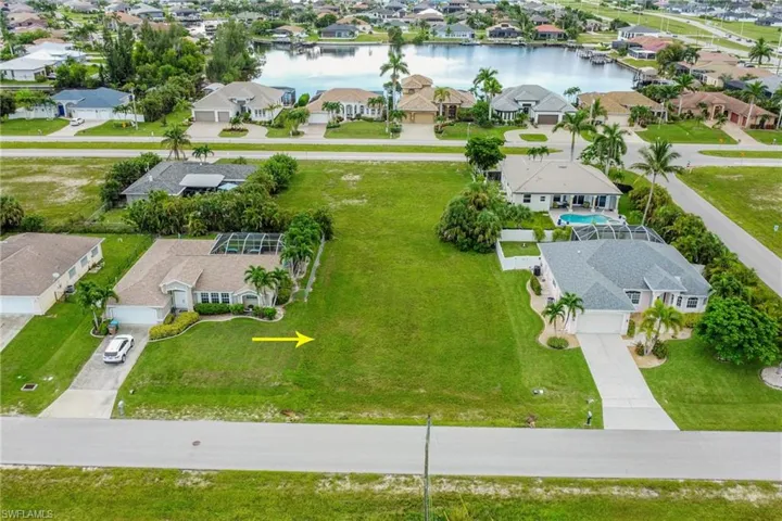Aerial view of residential area with a large body of water