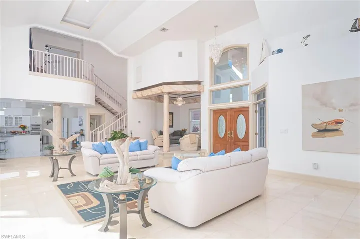 View facing sitting room, entryway and staircase leading to landing outside the Master Bedroom Suite. Sparkling marble floors add a bit of sophistication to this comfortable home.