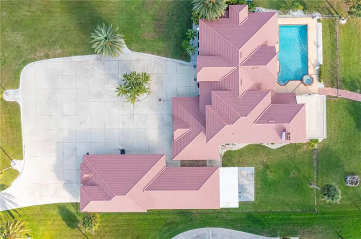 Overhead view of the home, pool, garage & lanai