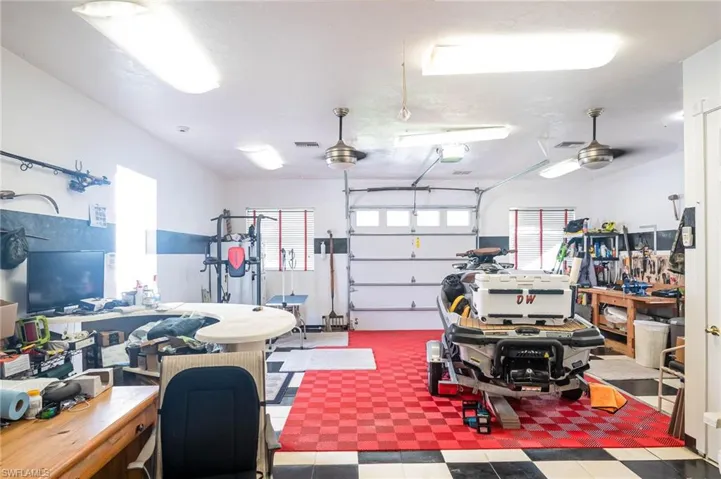 Four garage overhead doors.  RV Door in the front, smaller door at the back and two double doors on the side.  Lots of space for work benches and storge.