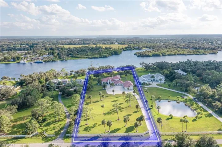 A truly unique property with amazing Caloosahatchee waterfront views, 3.88 Acres, 5775 SF modern home and 2748 SF Enclosed Garage, Boat dock with 2 lifts and Direct Gulf Access!  No HOA, No Deed Restrictions.  Zoned AG-2.  Close to I-75, Downtown River District and Babcock Ranch  A rare find indeed!