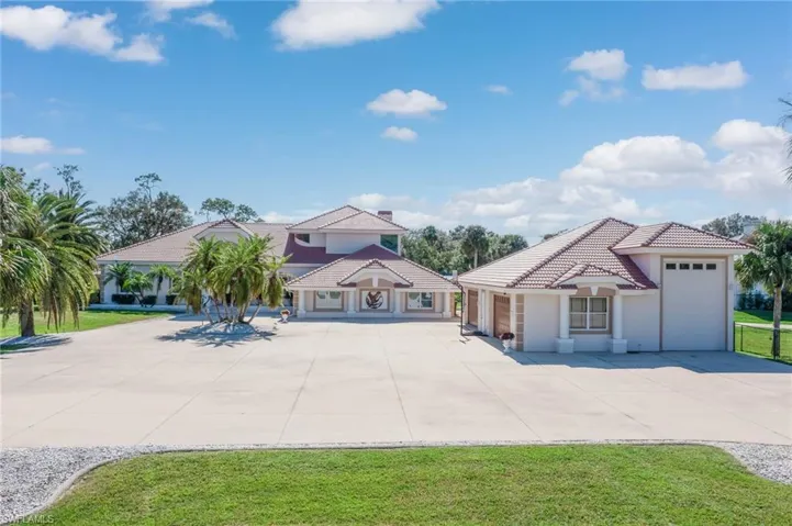 Spacious 5775 SF Open of indoor living space with an additional 2758 SF Air Conditioned garage.  Plenty of space for a large Class A Motorcoach, 6+ Cars, Boats, Toys, etc. Even a full bath and workshop.....could become the ultimate Man Cave!  Lots of space for parking an outdoor activities too!