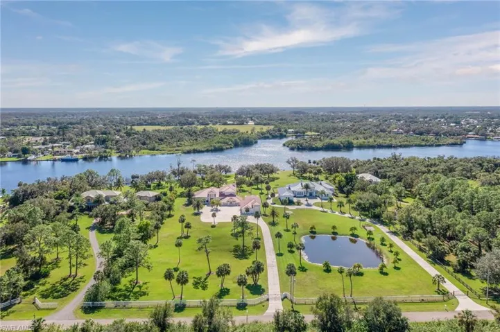 Expansive property sits on 3.88 Acres of pristine property with a long paved driveway and lots of native palms and oaks.  Offering the perfect blend of shade and open areas.