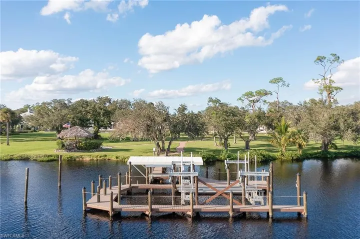 Lots of dock space here!  54,000lb lift can accommodate up to a 50' boat.  Second 10,000lb covered lift for smaller boats and waverunners plus mooring on either side for larger vessels. New dock and captains walk recently redone with Trex for durablity.