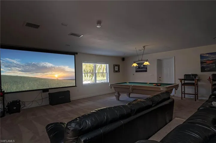 Private media room with leather theatre seating, pool table, queen murphy bed and seperate guest bedroom