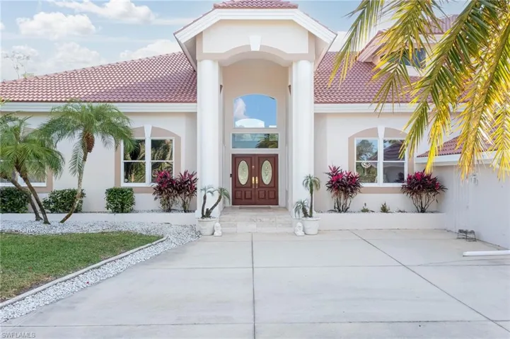 Dramatic entryway welcomes you into this lovely home.