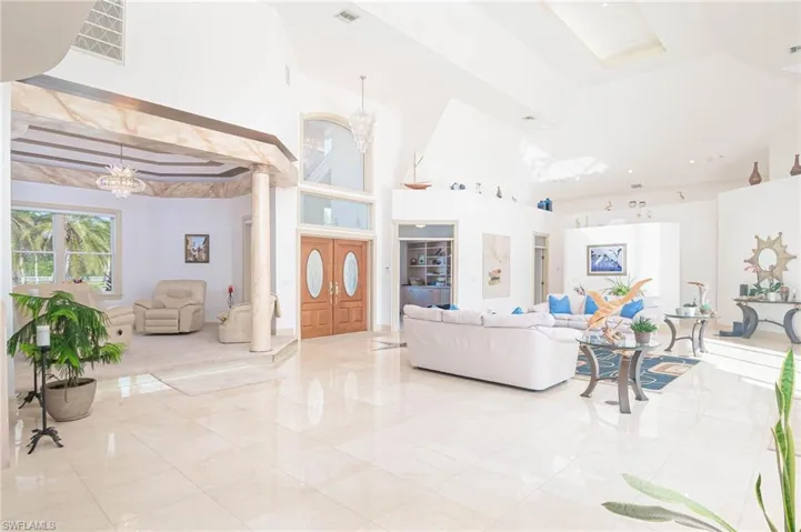 Beautiful sitting room with decorative trey ceiling and columns.  Perfect place for a piano too!