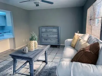 Tiled living room with ceiling fan