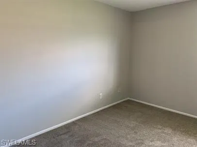 Empty room featuring carpet
