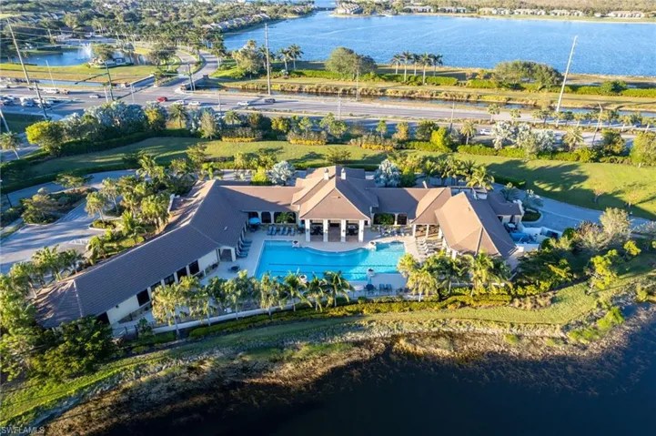 Aerial view of a nearby body of water and a pool