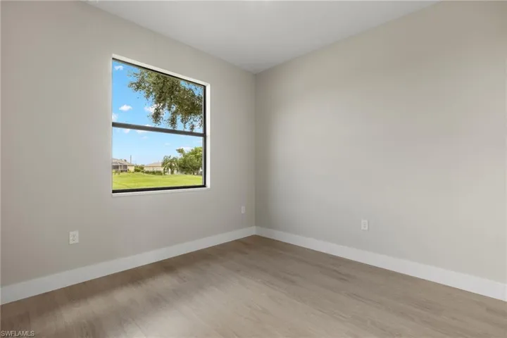 Unfurnished room featuring hardwood / wood-style floors