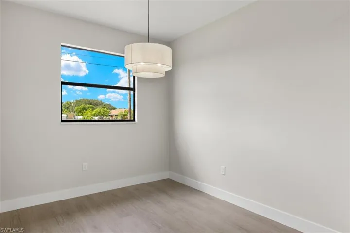 Unfurnished room featuring light wood-type flooring