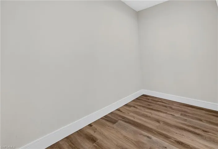 Neutral-toned walls and wood-finish flooring