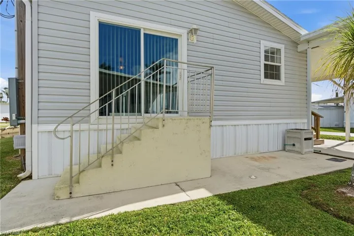 View of side of property with stairway