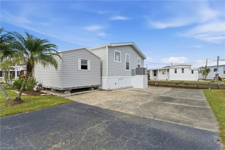 View of home's exterior featuring driveway