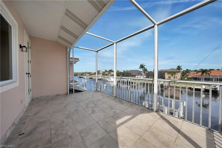 Private balcony featuring a water view