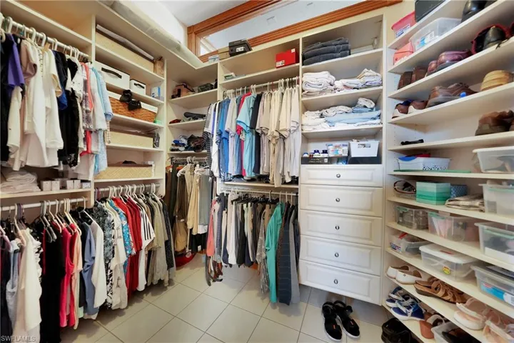Spacious closet featuring light tile patterned floors