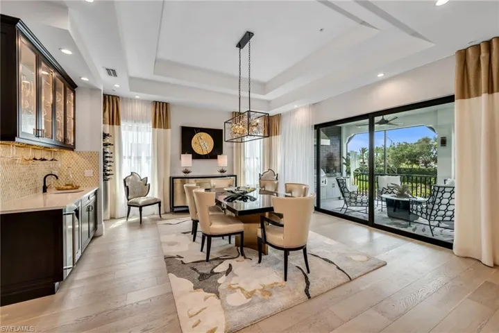 Dining enhanced by a sophisticated wet bar and curated wine selection, all within effortless reach.
