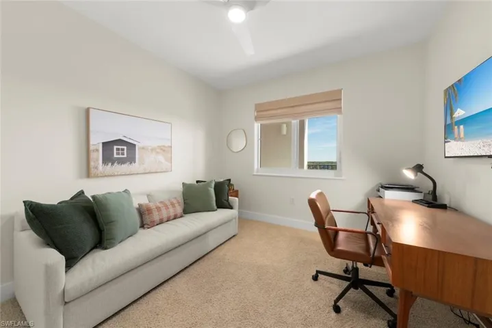 Office area featuring carpet flooring and ceiling fan