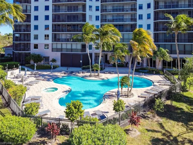 Community pool with a patio