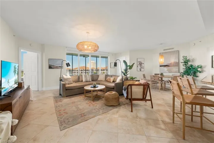 Living area featuring baseboards and light tile patterned flooring