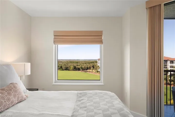Bedroom featuring multiple windows