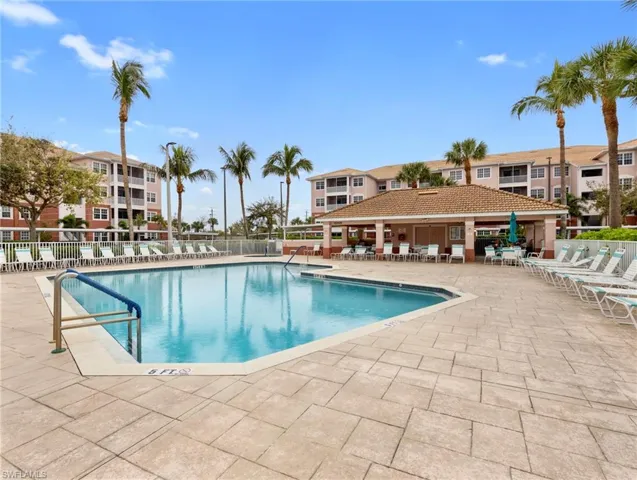 Community pool featuring a patio