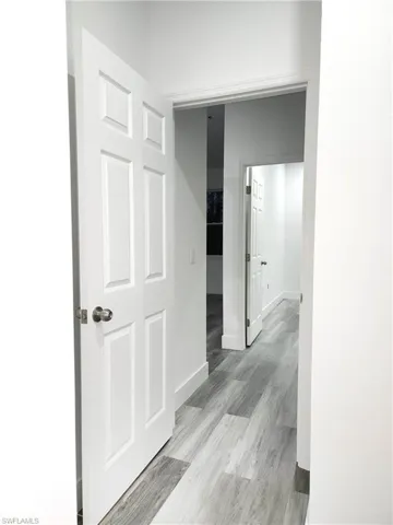Hall featuring Laminated Water Prove flooring.