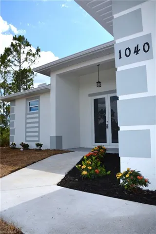 Entrance to property featuring High Double Doors.