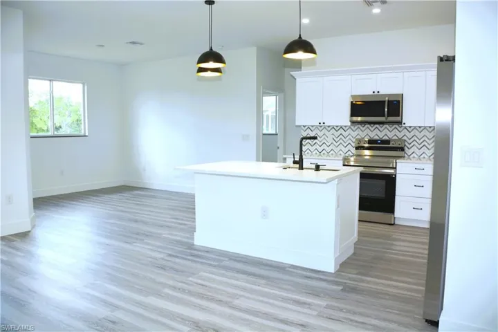 Kitchen Featuring Island with space to eat.