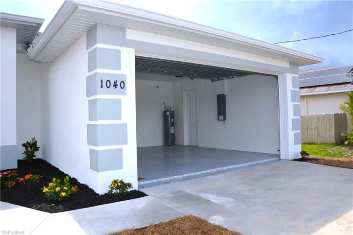 Garage with water heater.