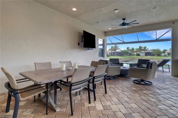 View of patio / terrace featuring outdoor lounge area, ceiling fan, and a lanai