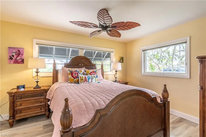 Bedroom with light wood-style flooring and a ceiling fan