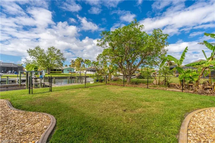 View of yard featuring a water view and a residential view