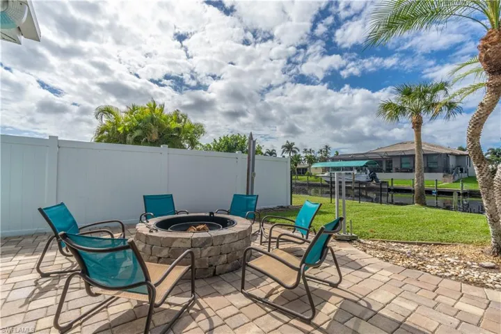 View of patio featuring an outdoor fire pit