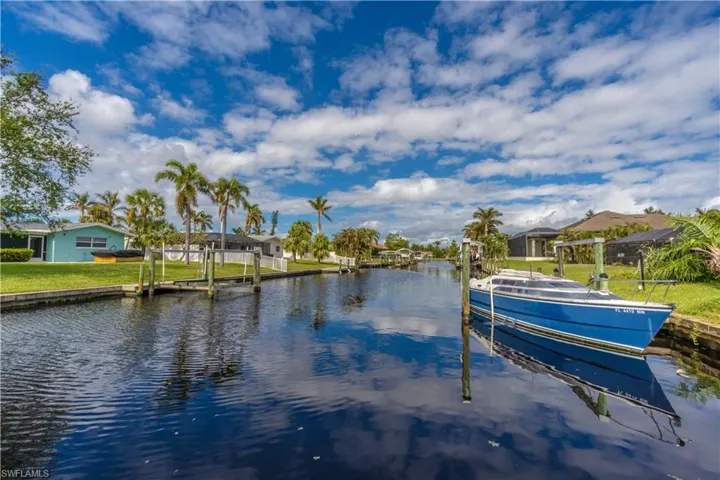 Dock with a water view and a residential view